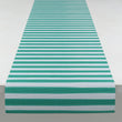 Chilewich striped woven mat with textured terrastrand yarn surface, featuring modern linear design and durable finish.