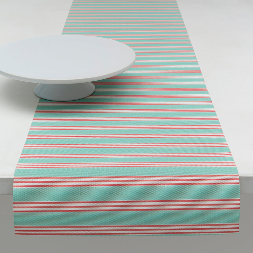 Chilewich striped woven mat with textured terrastrand yarn surface, featuring modern linear design and durable finish.