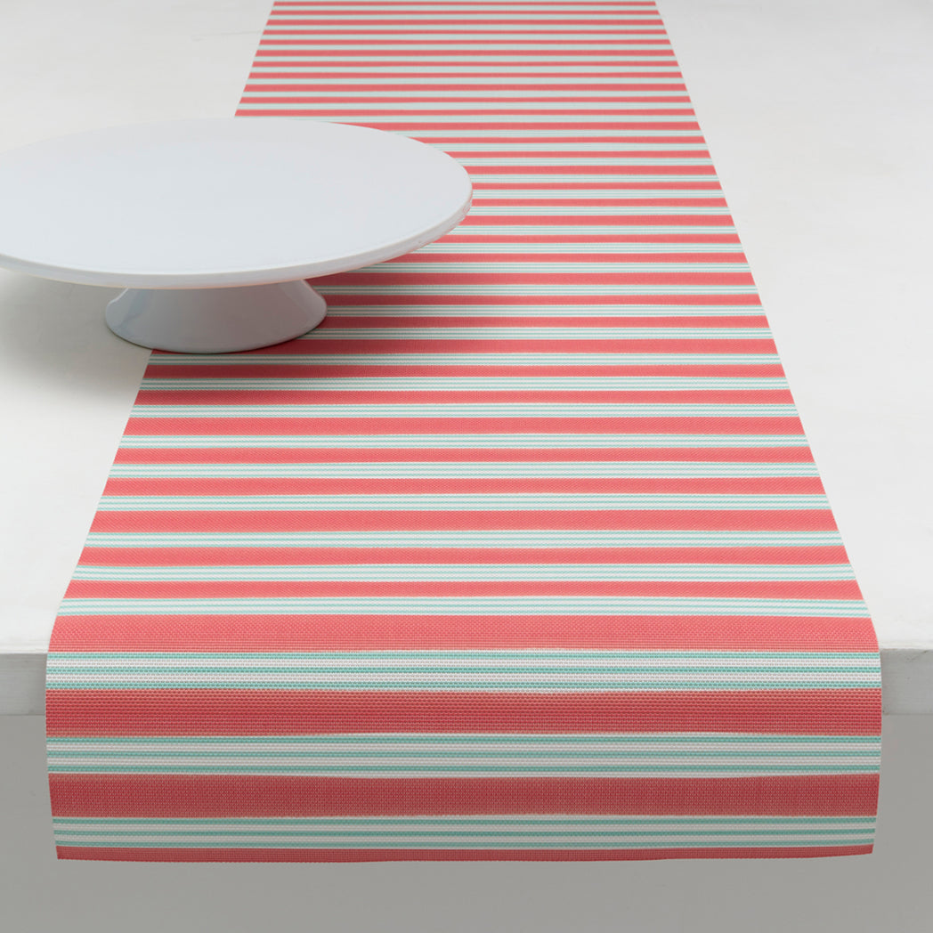 Chilewich striped woven mat with textured terrastrand yarn surface, featuring modern linear design and durable finish.