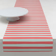 Chilewich striped woven mat with textured terrastrand yarn surface, featuring modern linear design and durable finish.