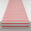 Chilewich striped woven mat with textured terrastrand yarn surface, featuring modern linear design and durable finish.