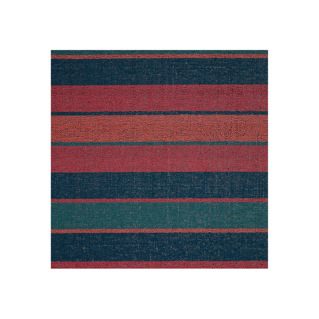 Chilewich striped woven mat with textured terrastrand yarn surface, featuring modern linear design and durable finish.