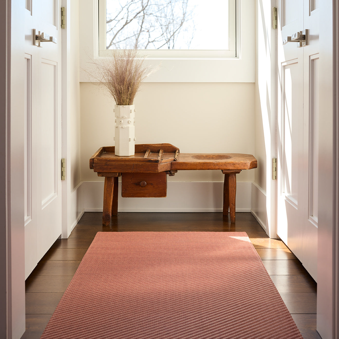 Chilewich woven floor mat in neutral woven terrastrand yarn, durable and stylish for modern living spaces.