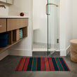 Chilewich striped woven mat with textured terrastrand yarn surface, featuring modern linear design and durable finish.