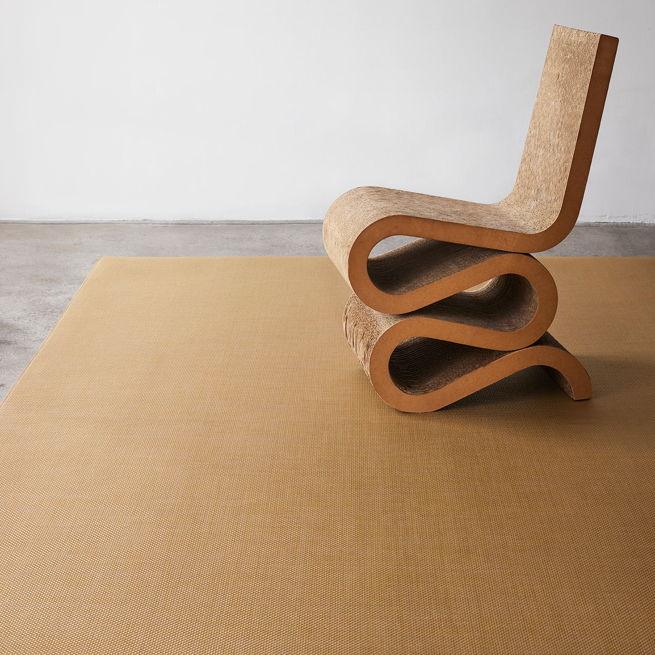 Chilewich Basketweave floor mat in neutral tone, showcasing woven terrastrand yarn texture and modern design aesthetic.