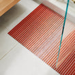 Chilewich woven floor mat in neutral woven terrastrand yarn, durable and stylish for modern living spaces.