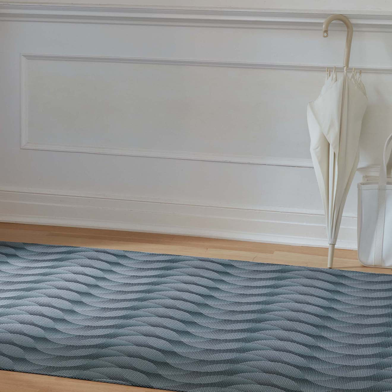 Chilewich woven floor mat in neutral woven terrastrand yarn, durable and stylish for modern living spaces.