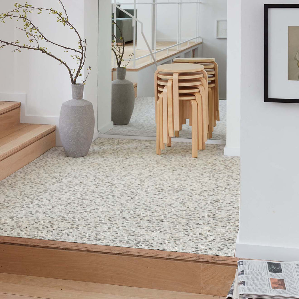 Chilewich woven floor mat in neutral woven terrastrand yarn, durable and stylish for modern living spaces.
