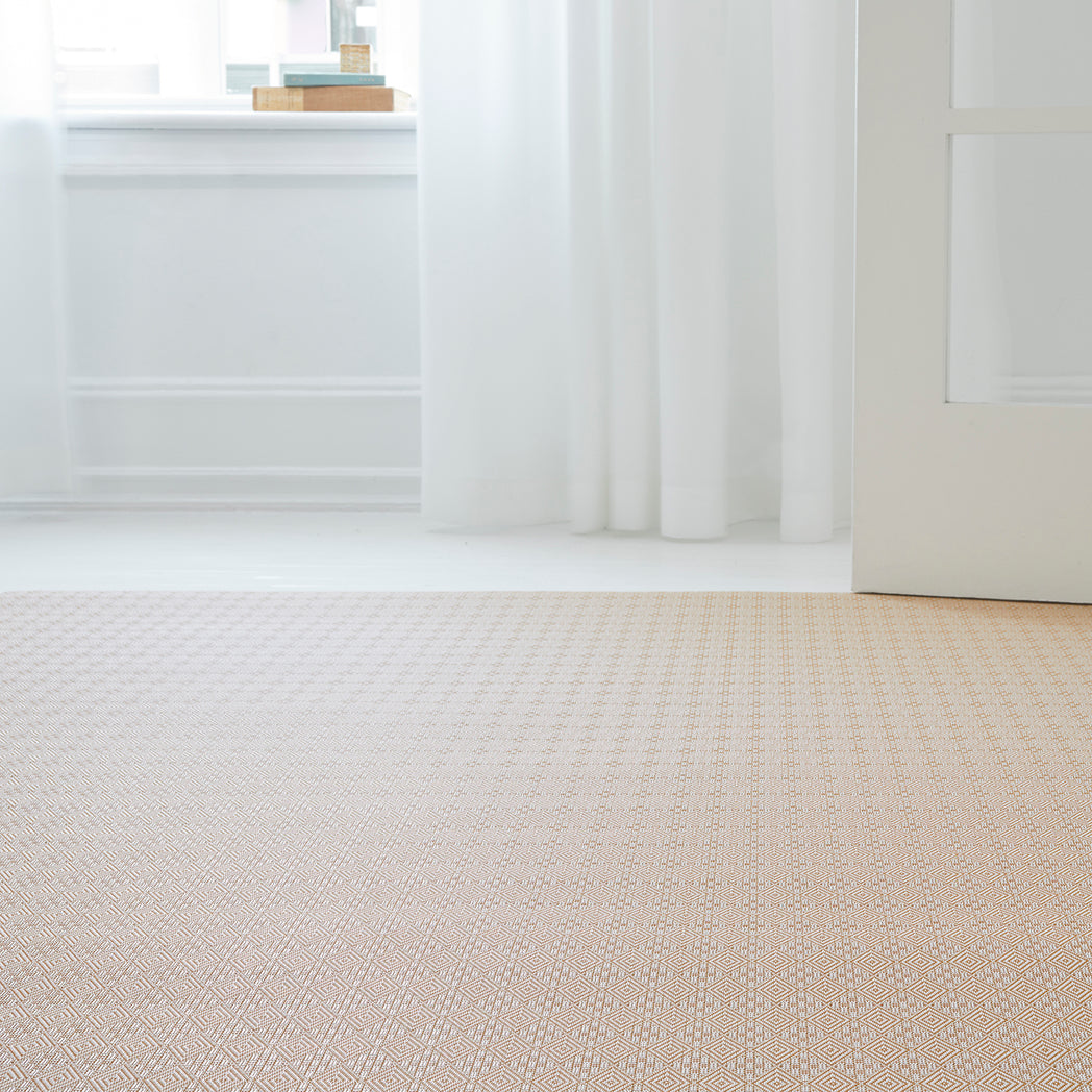 Chilewich woven floor mat in neutral woven terrastrand yarn, durable and stylish for modern living spaces.