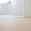 Chilewich woven floor mat in neutral woven terrastrand yarn, durable and stylish for modern living spaces.