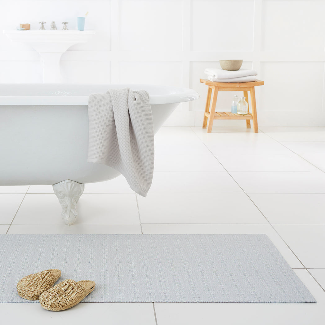 Chilewich woven floor mat in neutral woven terrastrand yarn, durable and stylish for modern living spaces.