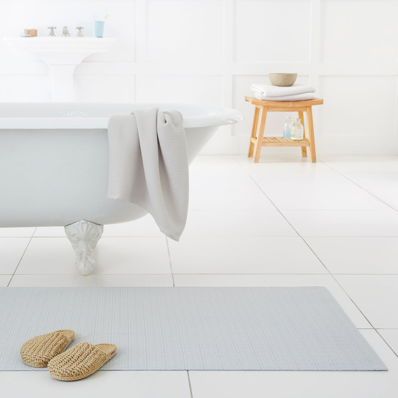 Chilewich woven floor mat in neutral woven terrastrand yarn, durable and stylish for modern living spaces.