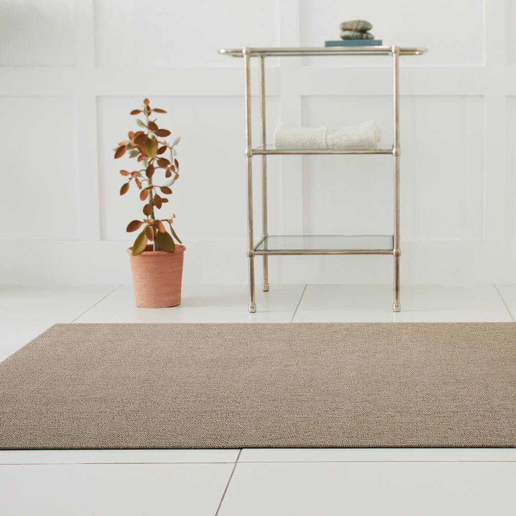 Chilewich woven floor mat in neutral woven terrastrand yarn, durable and stylish for modern living spaces.