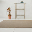 Chilewich woven floor mat in neutral woven terrastrand yarn, durable and stylish for modern living spaces.