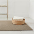Chilewich woven floor mat in neutral woven terrastrand yarn, durable and stylish for modern living spaces.