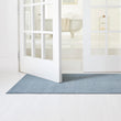 Chilewich woven floor mat in neutral woven terrastrand yarn, durable and stylish for modern living spaces.
