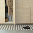 Chilewich striped woven mat with textured terrastrand yarn surface, featuring modern linear design and durable finish.