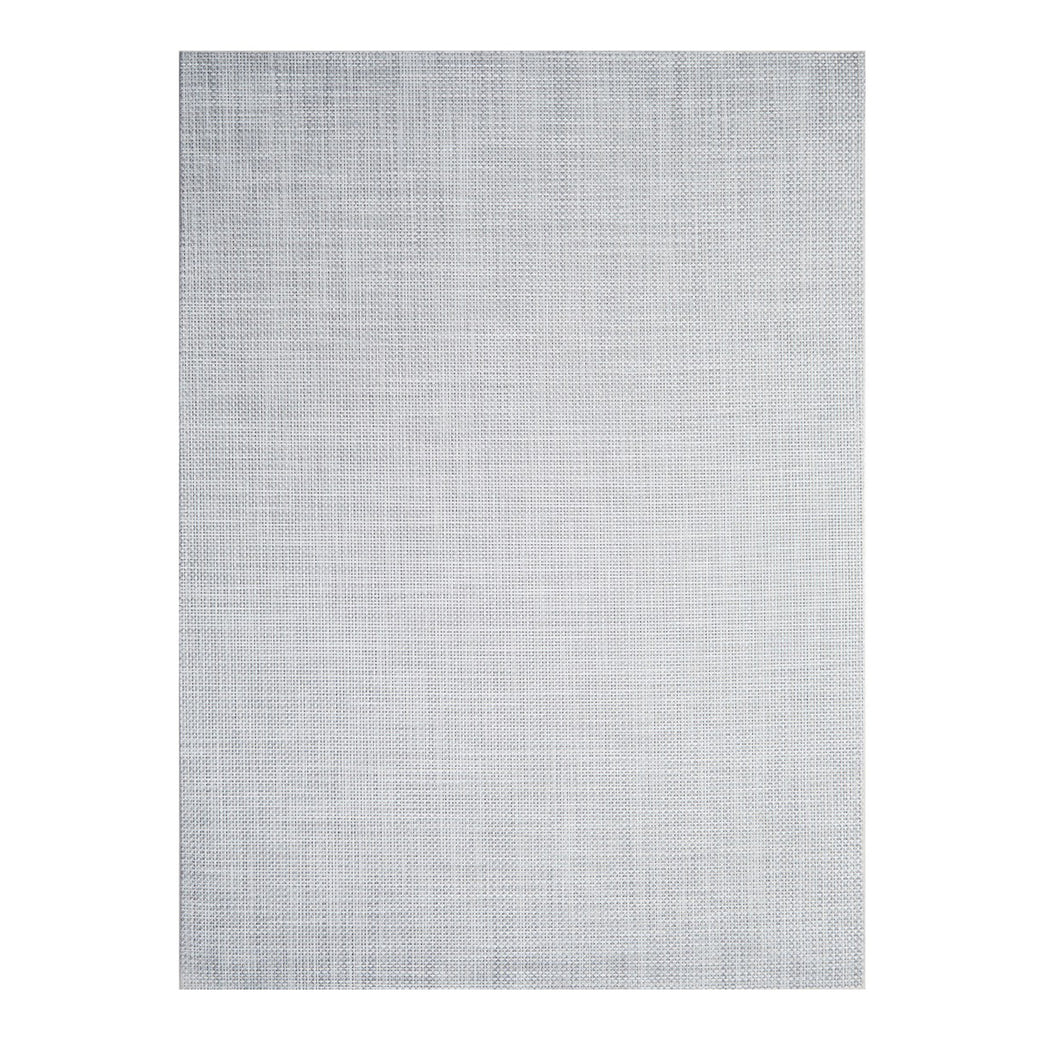 Chilewich Basketweave floor mat in WhiteSilver, showcasing woven terrastrand yarn texture and modern design aesthetic.
