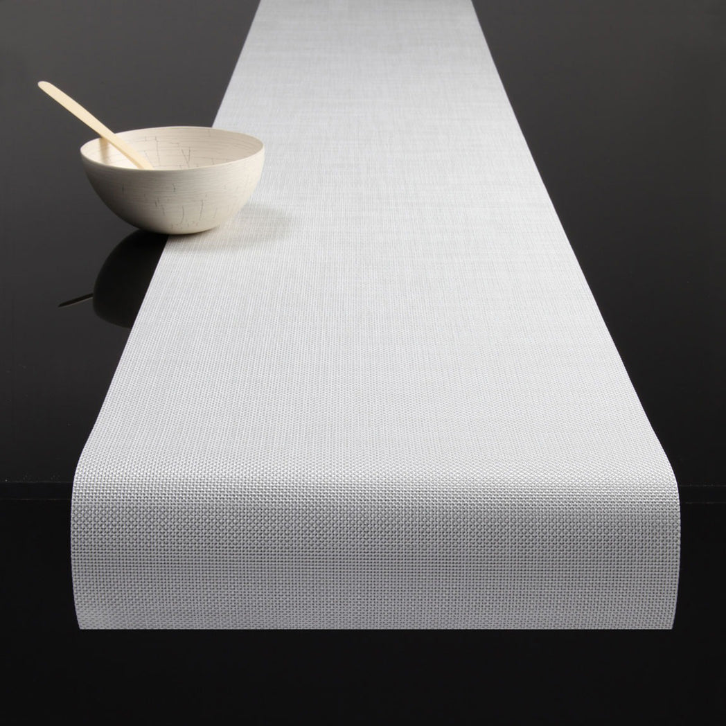 Chilewich Basketweave floor mat in White, showcasing woven terrastrand yarn texture and modern design aesthetic.