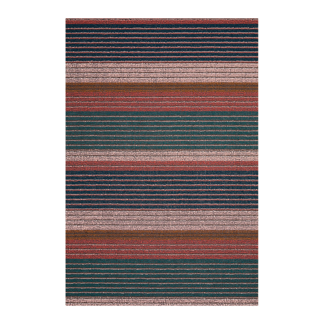 Chilewich striped woven mat with textured terrastrand yarn surface, featuring modern linear design and durable finish.