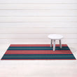 Chilewich striped woven mat with textured terrastrand yarn surface, featuring modern linear design and durable finish.