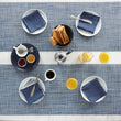 Chilewich Basketweave floor mat in Chambray, showcasing woven terrastrand yarn texture and modern design aesthetic.