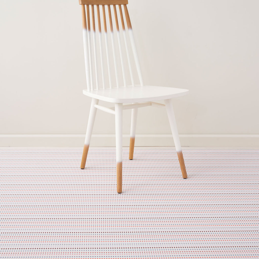 Pop Woven Floor Mat with Prop in Light Neutral Beige with Light Pink, Lavender, Dark Blue and Bright Orange Pink
