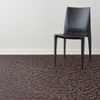Cider Woven Floor Mat with Prop in Mix of Dark Brown and Muted Red Orange Tones