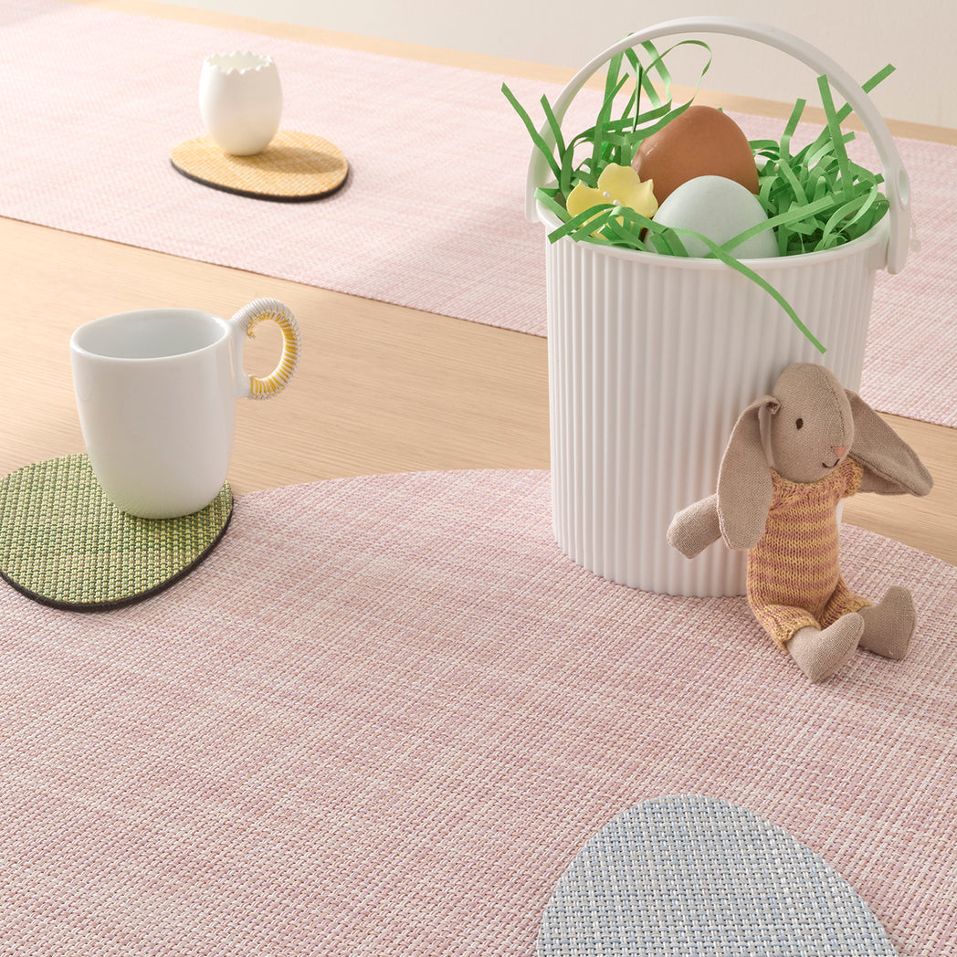 Chilewich Basketweave floor mat in egg, showcasing woven terrastrand yarn texture and modern design aesthetic.