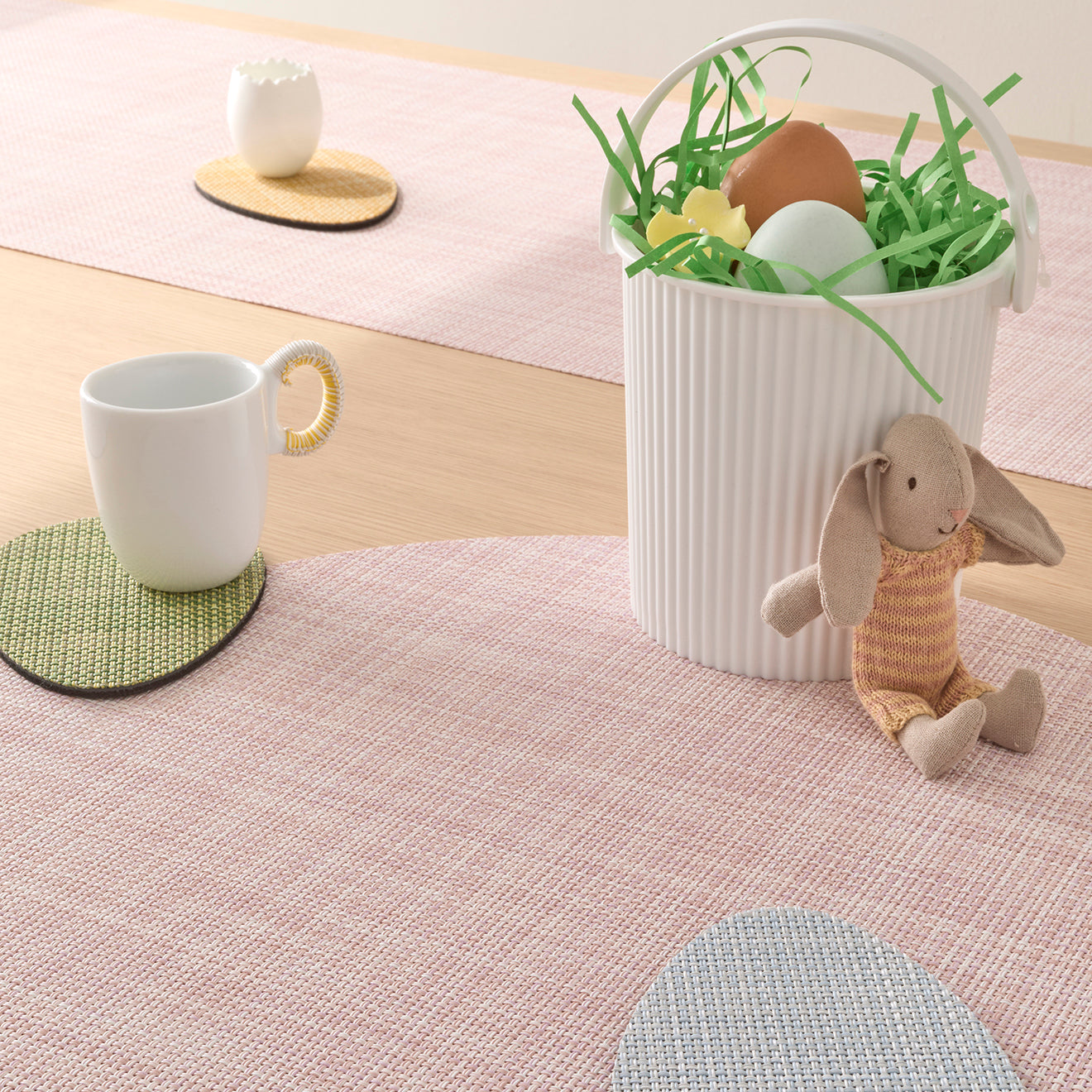 Chilewich Basketweave floor mat in egg, showcasing woven terrastrand yarn texture and modern design aesthetic.
