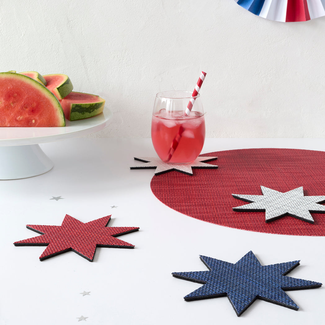 Chilewich Basketweave floor mat in firecrackers, showcasing woven terrastrand yarn texture and modern design aesthetic.