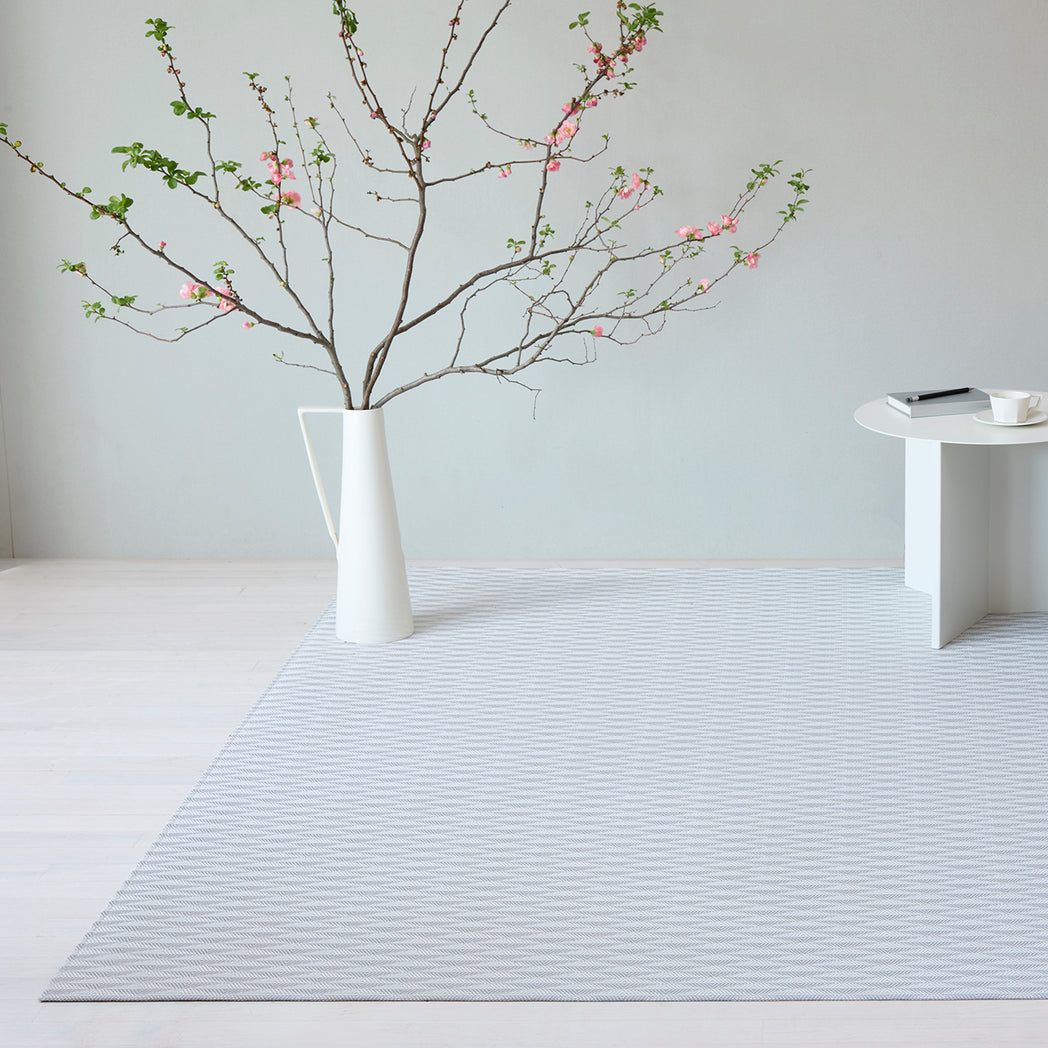 Chilewich woven floor mat in neutral woven terrastrand yarn, durable and stylish for modern living spaces.