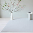 Chilewich woven floor mat in neutral woven terrastrand yarn, durable and stylish for modern living spaces.