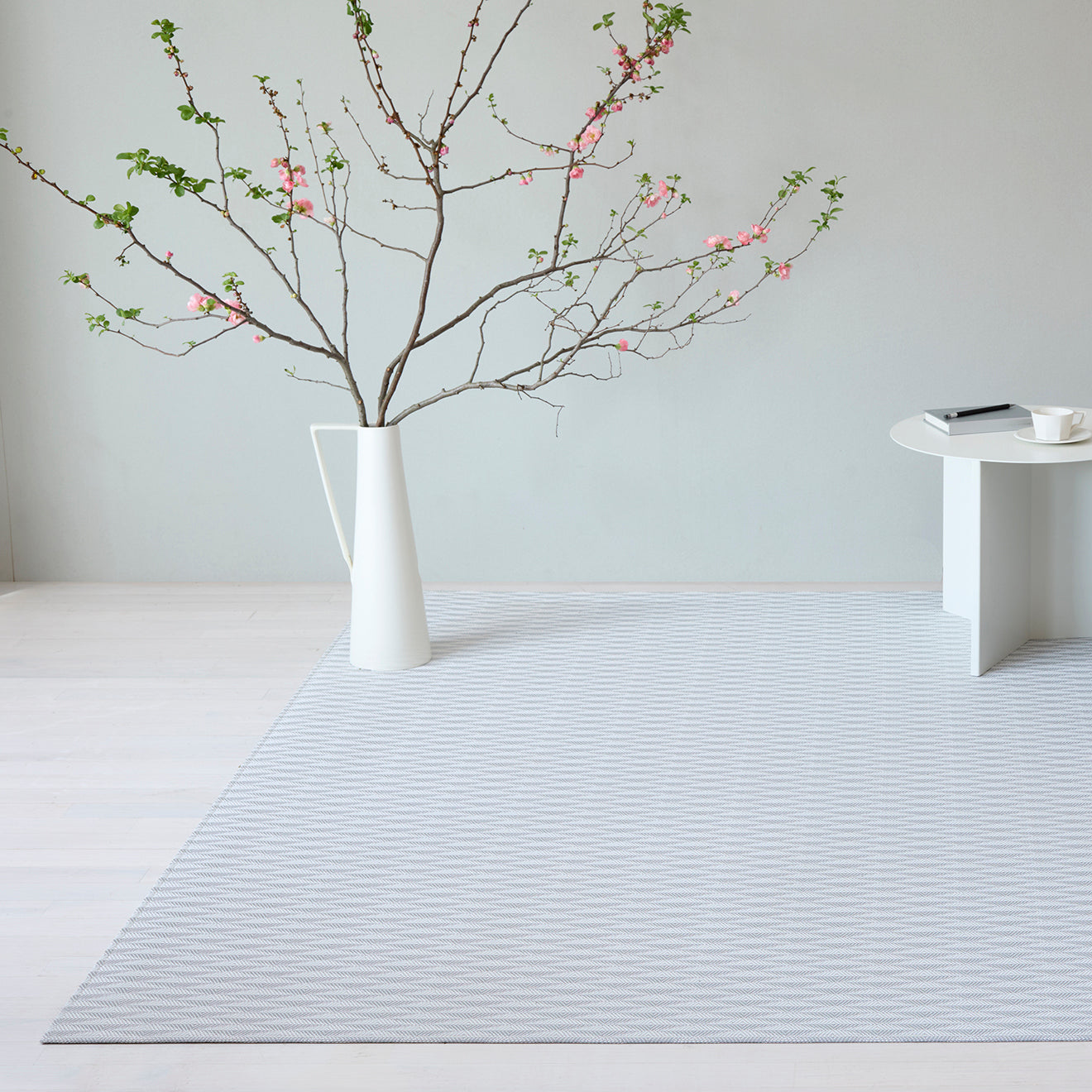 Chilewich woven floor mat in neutral woven terrastrand yarn, durable and stylish for modern living spaces.
