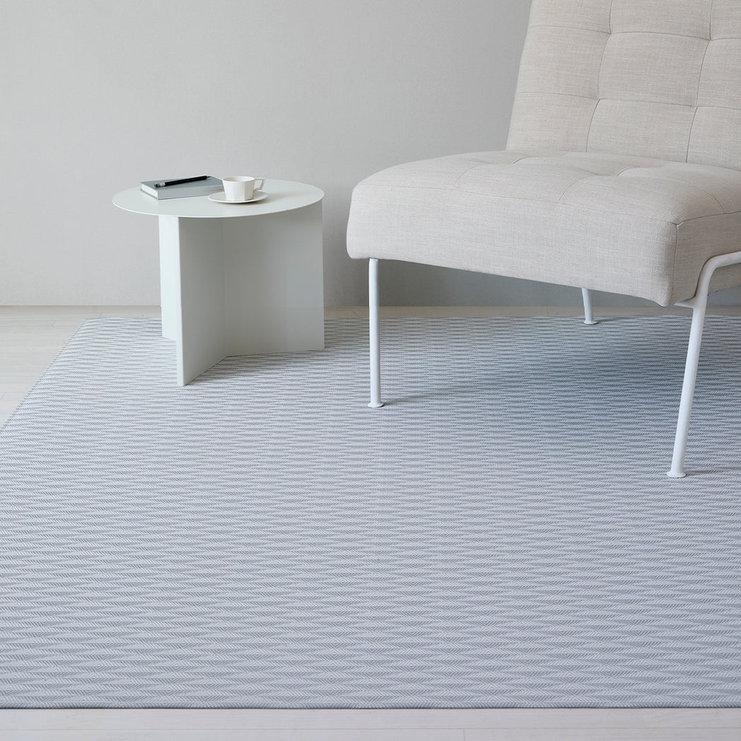 Chilewich woven floor mat in neutral woven terrastrand yarn, durable and stylish for modern living spaces.