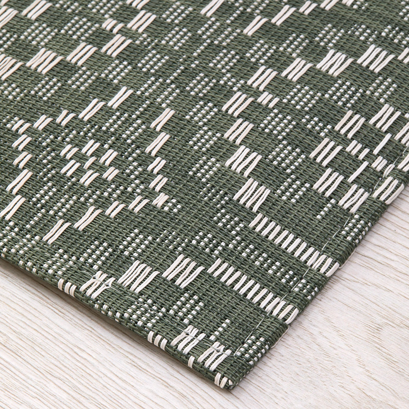 Chilewich woven floor mat in neutral woven terrastrand yarn, durable and stylish for modern living spaces.