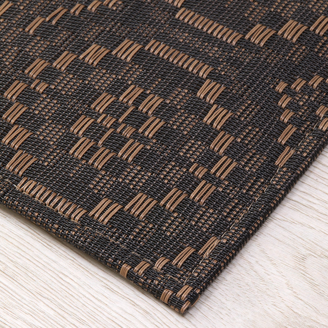 Chilewich woven floor mat in neutral woven terrastrand yarn, durable and stylish for modern living spaces.