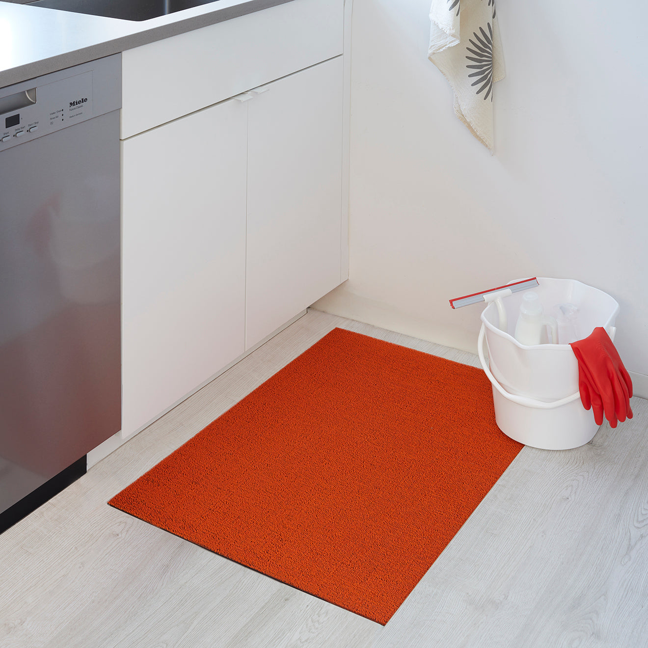 Chilewich woven floor mat in neutral woven terrastrand yarn, durable and stylish for modern living spaces.