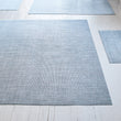 Chilewich woven floor mat in neutral woven terrastrand yarn, durable and stylish for modern living spaces.