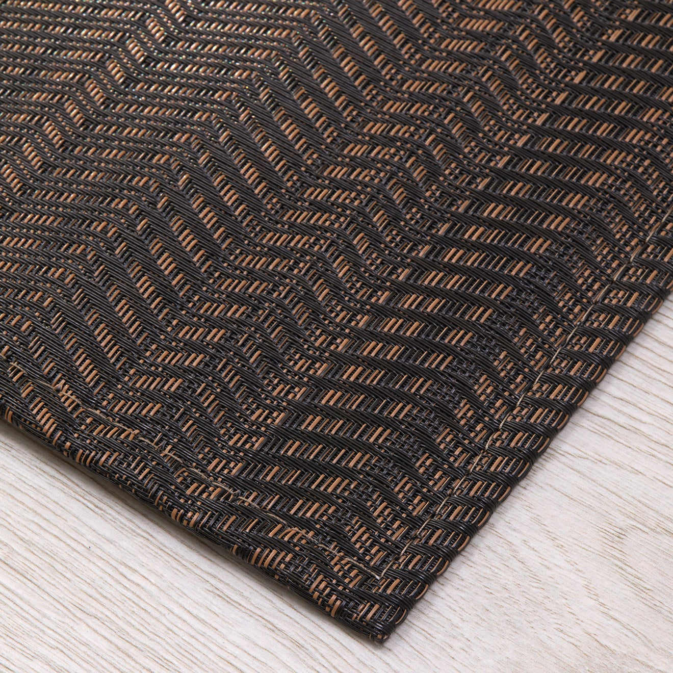 Chilewich woven floor mat in neutral woven terrastrand yarn, durable and stylish for modern living spaces.