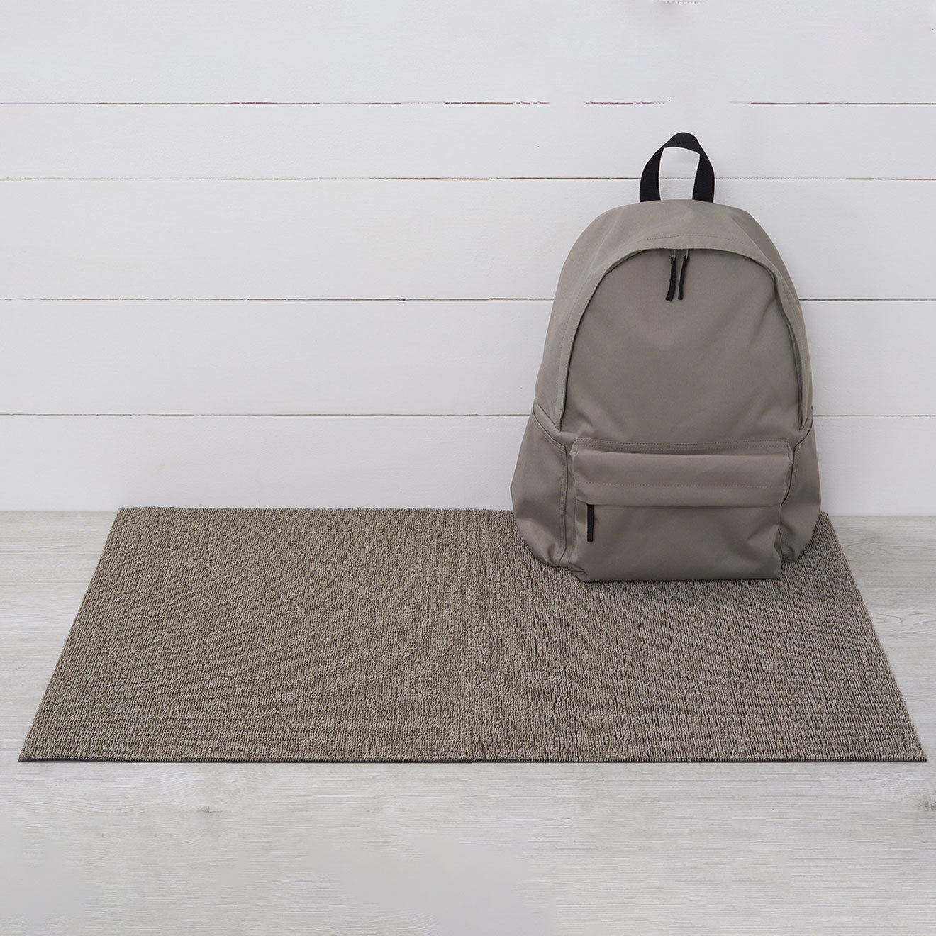 Chilewich woven floor mat in neutral woven terrastrand yarn, durable and stylish for modern living spaces.