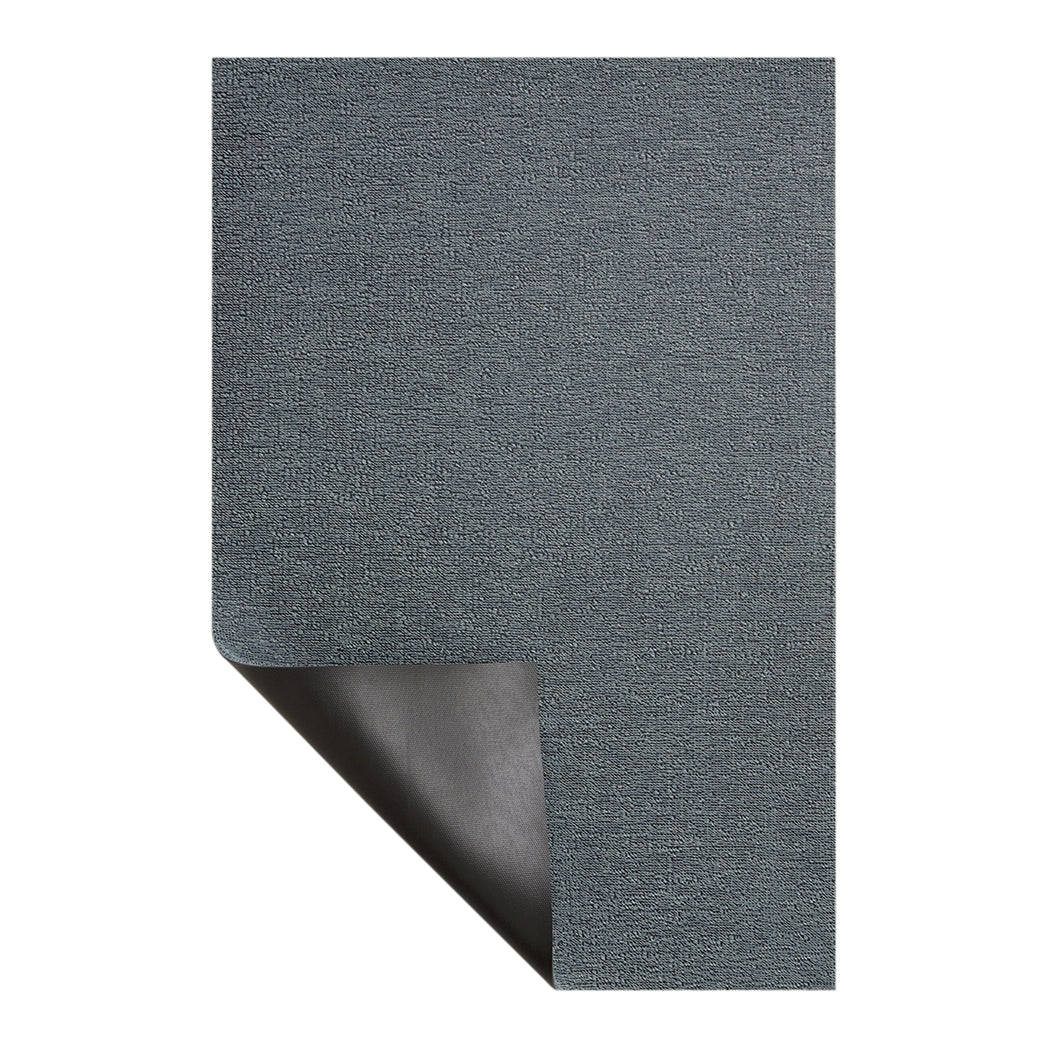Chilewich woven floor mat in neutral woven terrastrand yarn, durable and stylish for modern living spaces.