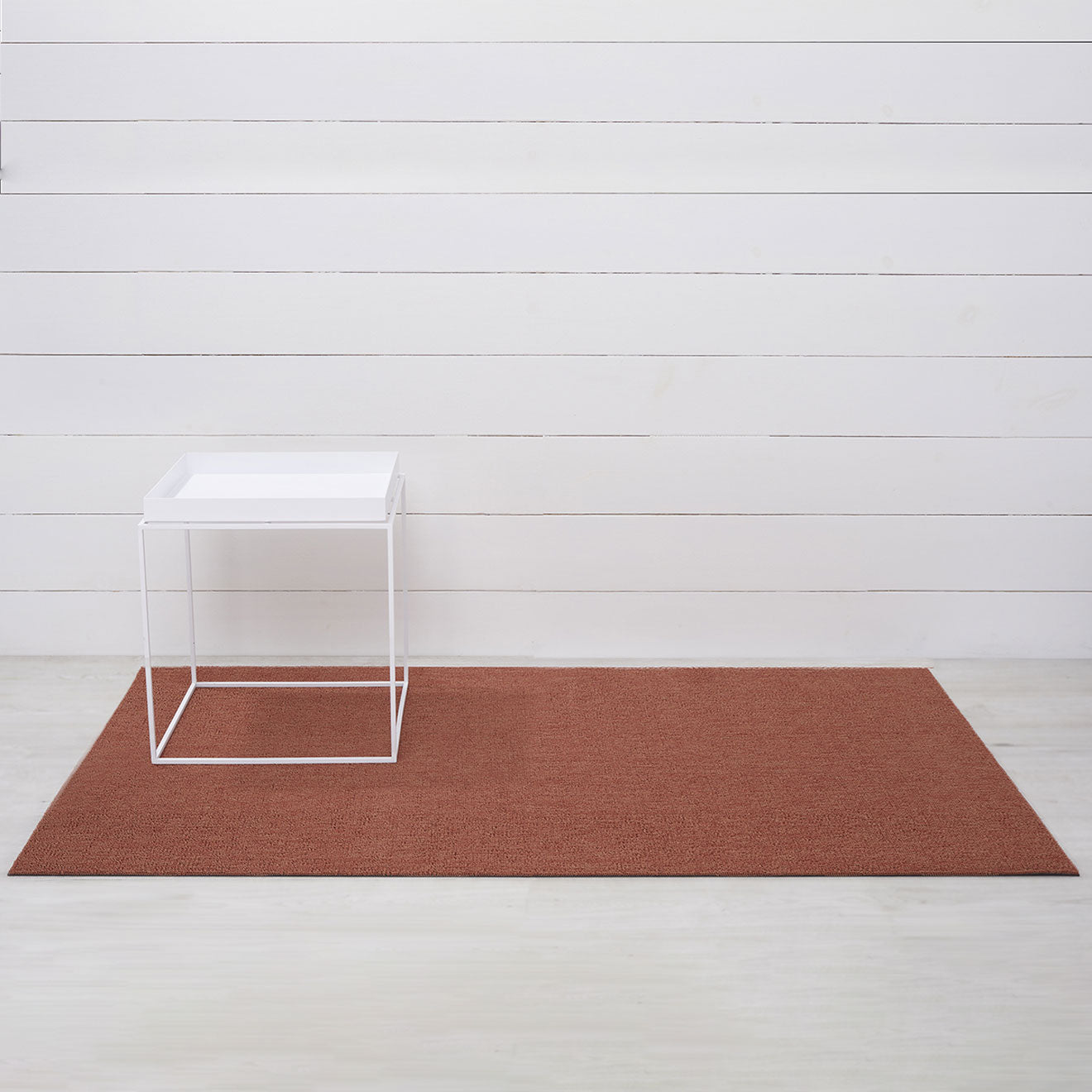 Chilewich woven floor mat in neutral woven terrastrand yarn, durable and stylish for modern living spaces.