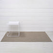 Chilewich woven floor mat in neutral woven terrastrand yarn, durable and stylish for modern living spaces.