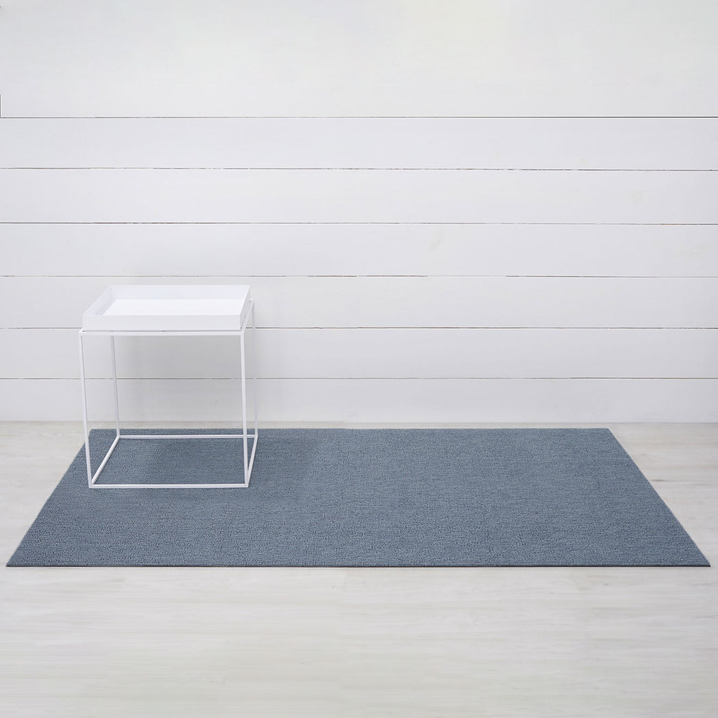 Chilewich woven floor mat in neutral woven terrastrand yarn, durable and stylish for modern living spaces.