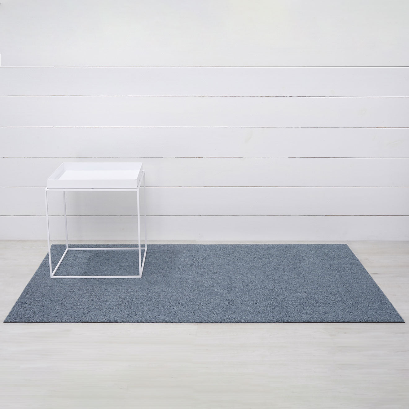 Chilewich woven floor mat in neutral woven terrastrand yarn, durable and stylish for modern living spaces.