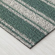 Chilewich striped woven mat with textured terrastrand yarn surface, featuring modern linear design and durable finish.