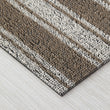 Chilewich striped woven mat with textured terrastrand yarn surface, featuring modern linear design and durable finish.