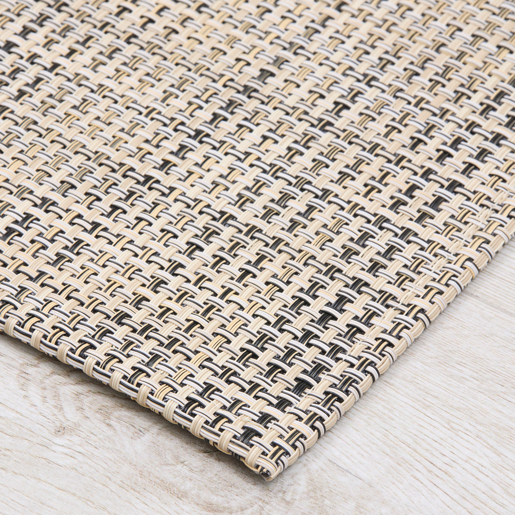 Chilewich Basketweave floor mat in buckwheat, showcasing woven terrastrand yarn texture and modern design aesthetic.
