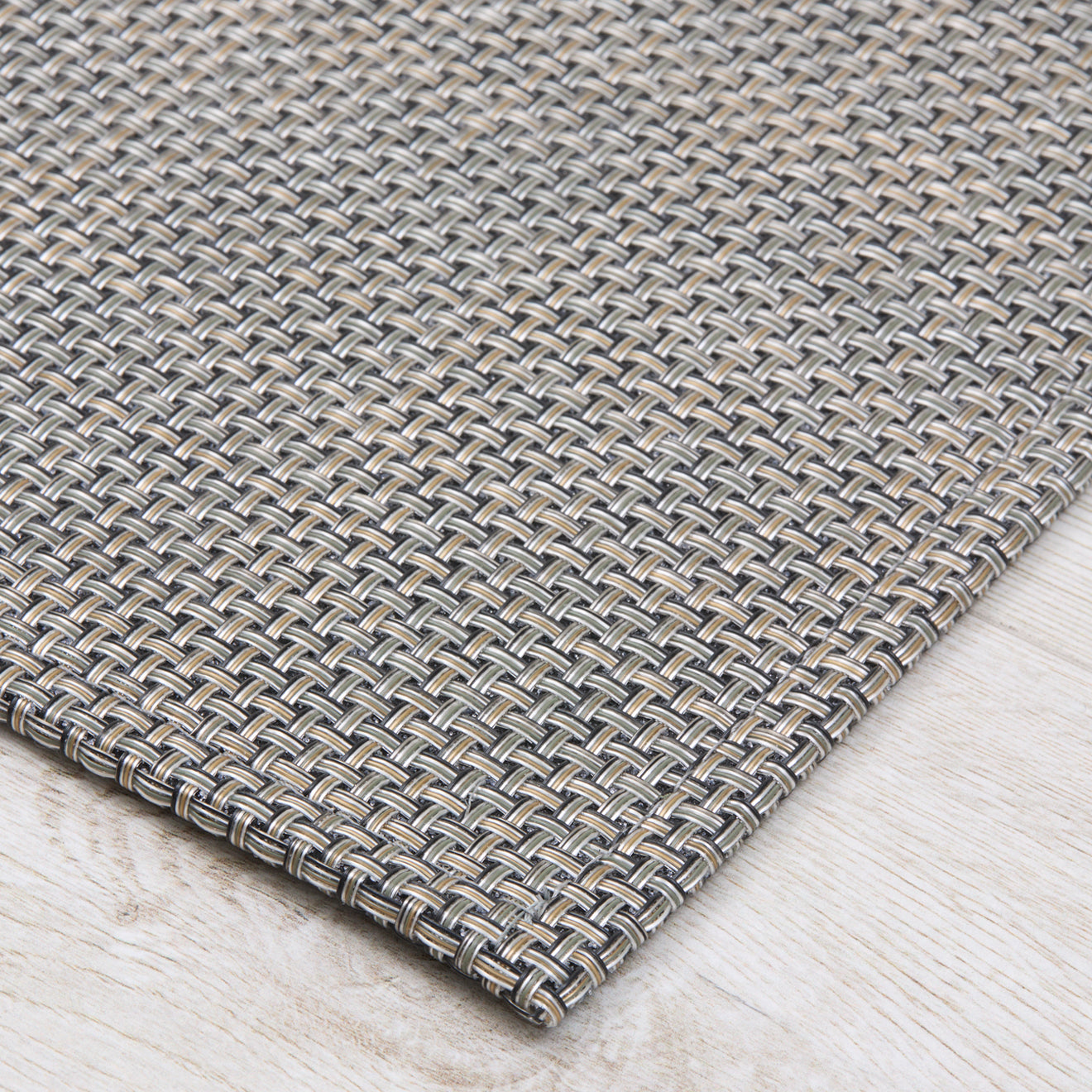 Chilewich Basketweave floor mat in platinum, showcasing woven terrastrand yarn texture and modern design aesthetic.